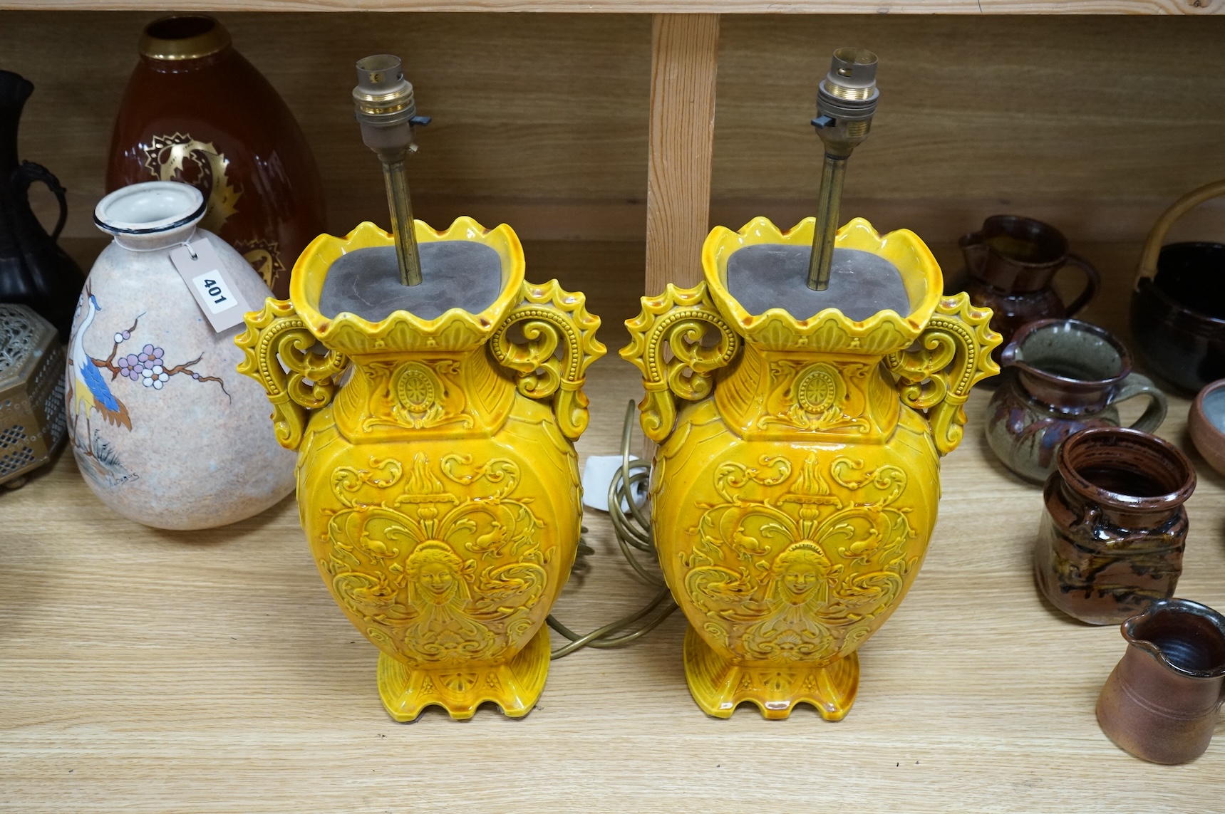 A pair of late 19th century Majolica yellow glazed vases, mounted as table lamps, marked ‘W & Co’ to base, 47cm total